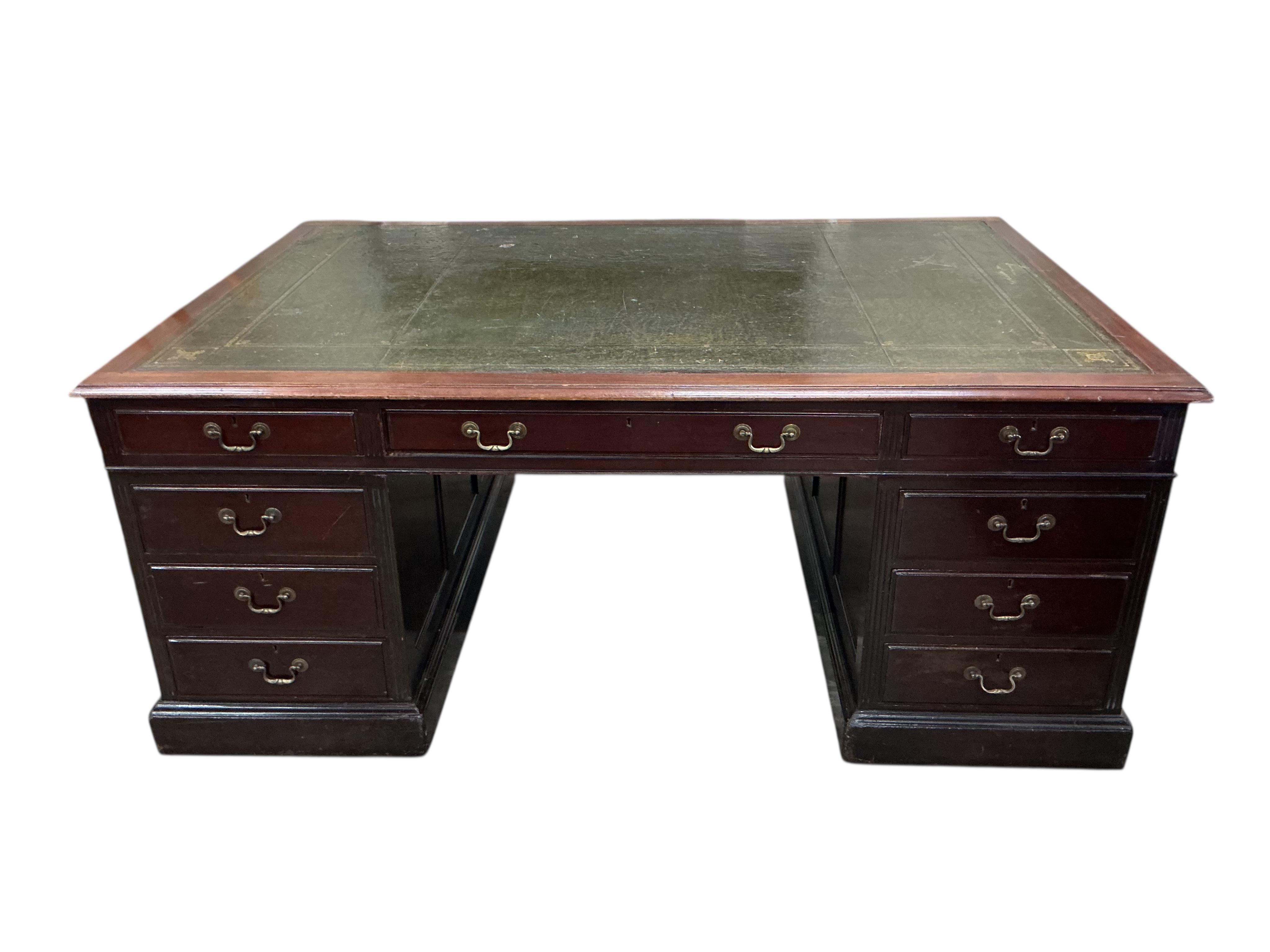 A reproduction George III style mahogany pedestal partners desk, width 180cm, depth 120cm, height 76cm, together with a button green leather swivel desk chair